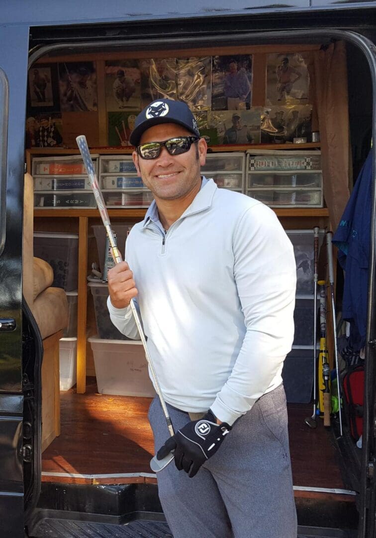 A man holding a baseball bat in his hand.